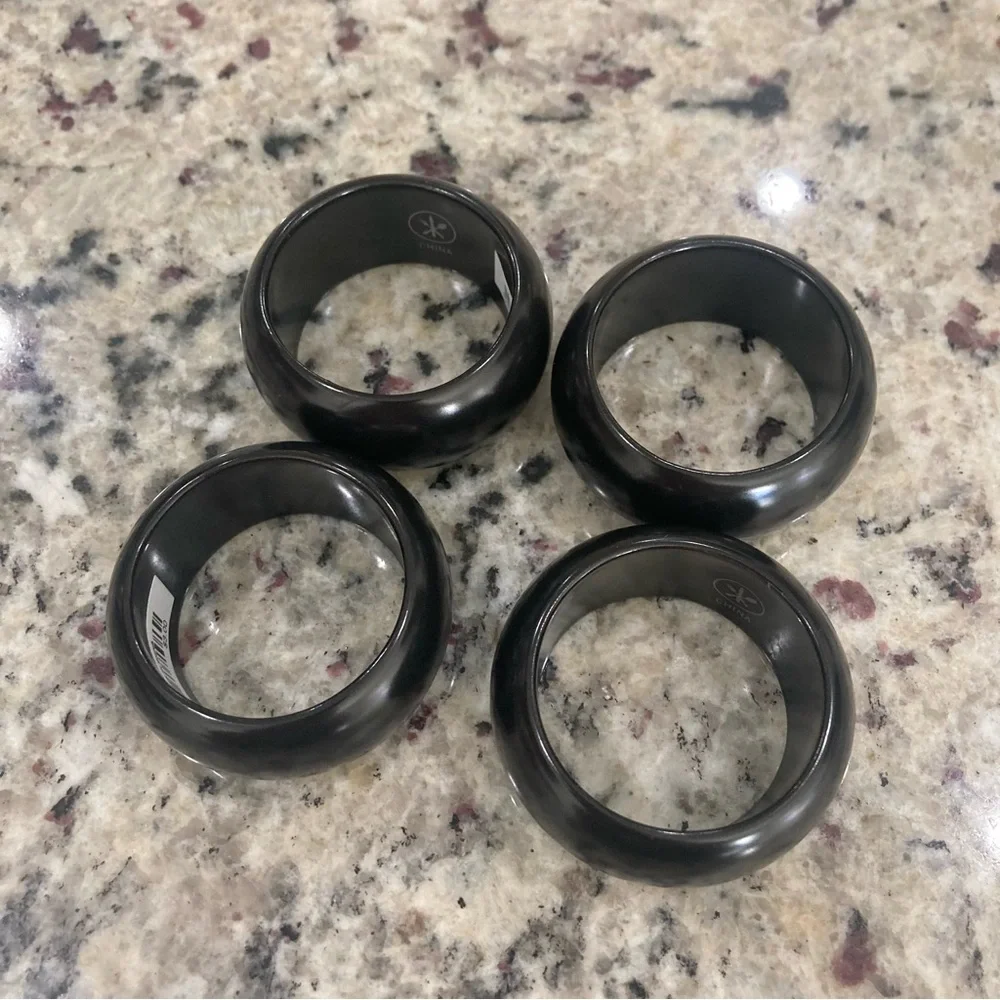 NWT Pier 1 Imports set of 4 black with white on one side ceramic napkin rings